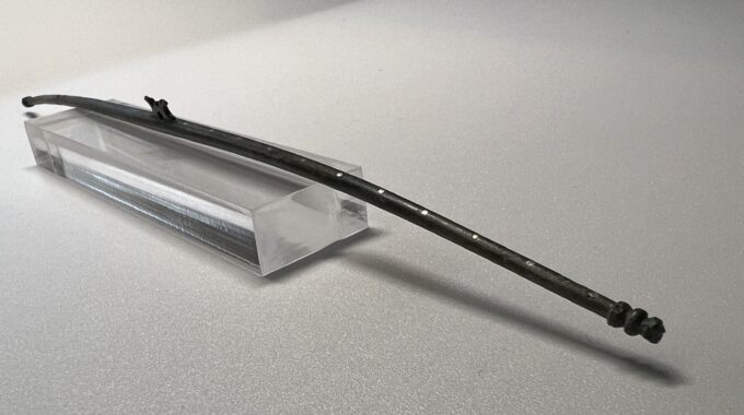 Close up image of copper alloy dual balance beam showing silver dots.