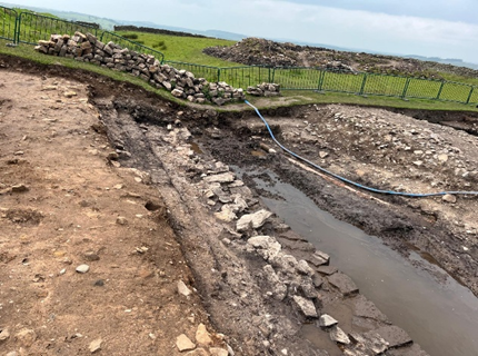 Image of an archaeological excavation of a roman ditch.